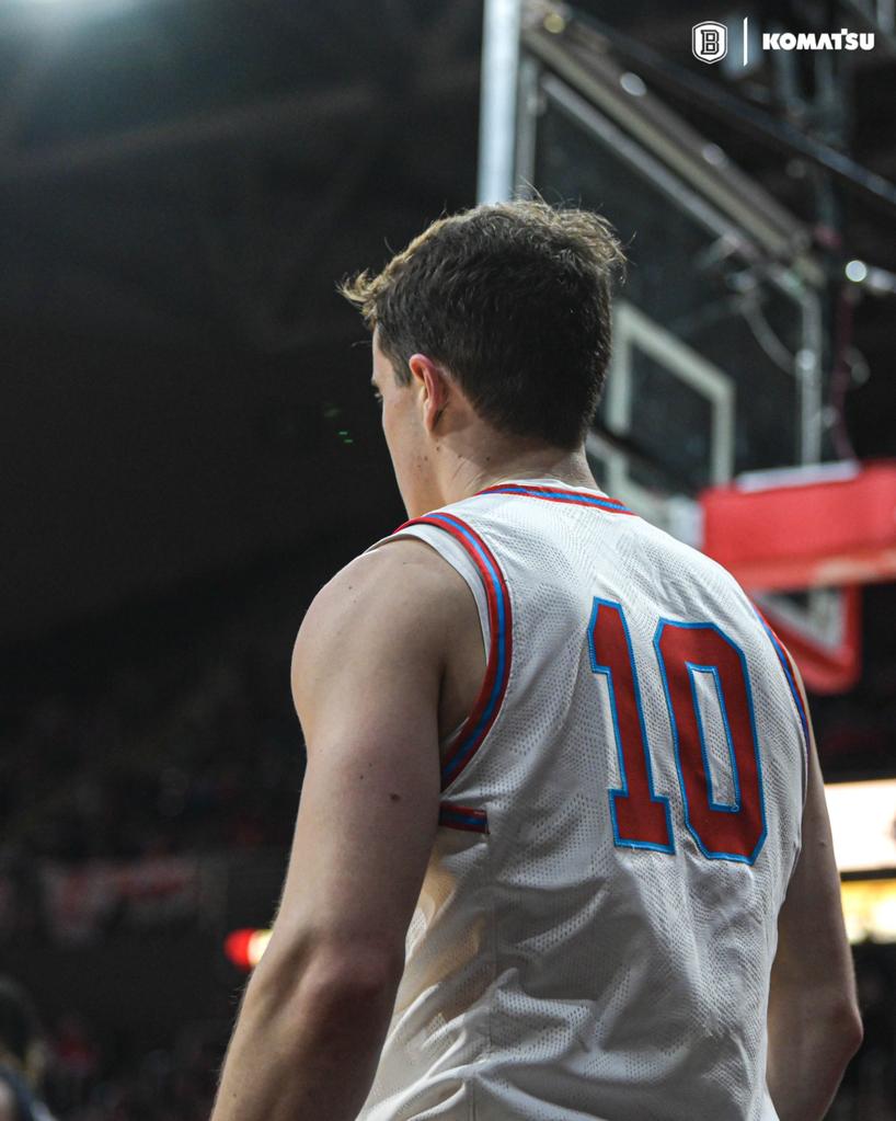 Connor Hickman, number 10, on the floor at Bradley