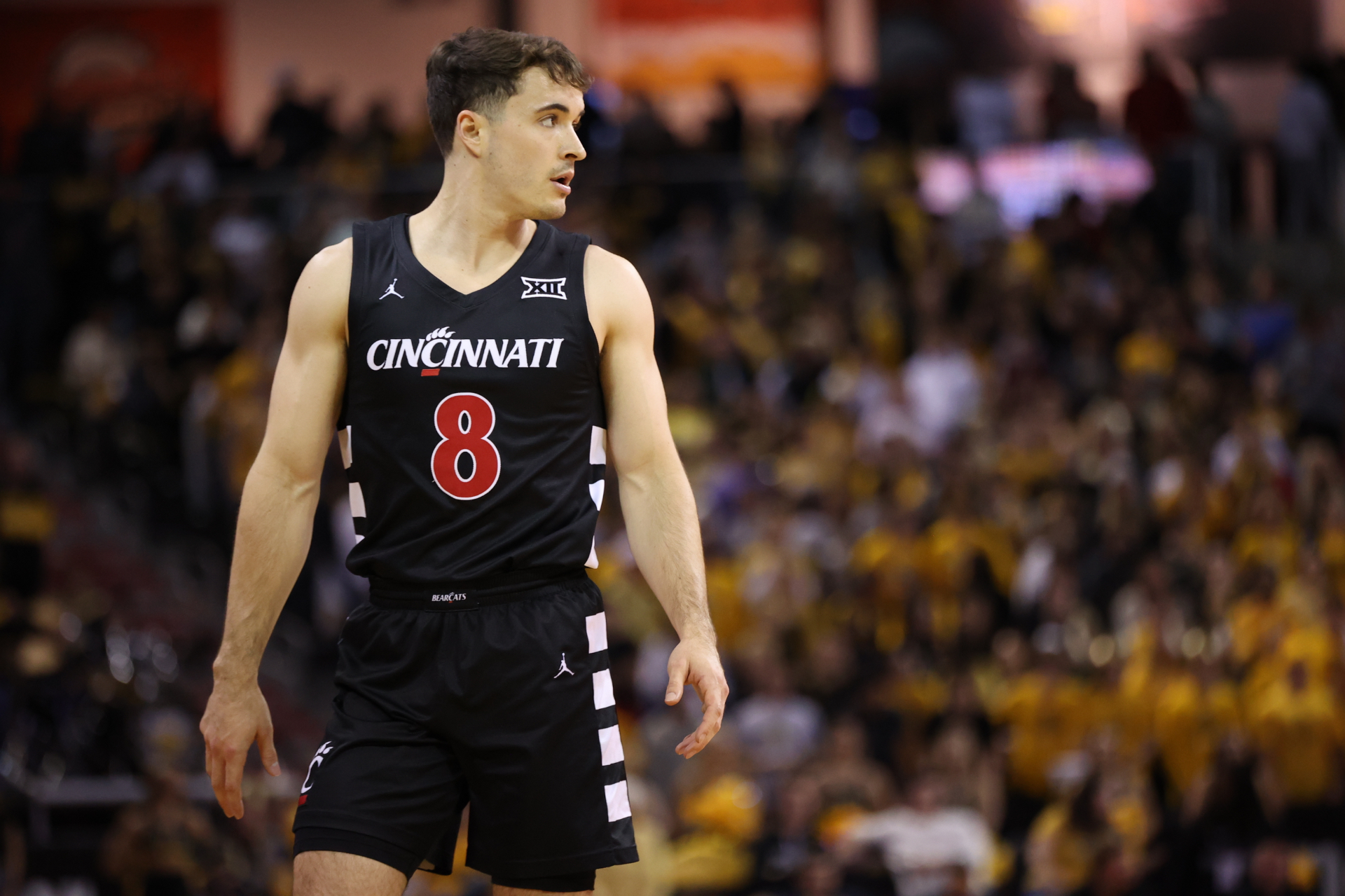 Connor Hickman on the court in a Cincinnati uniform